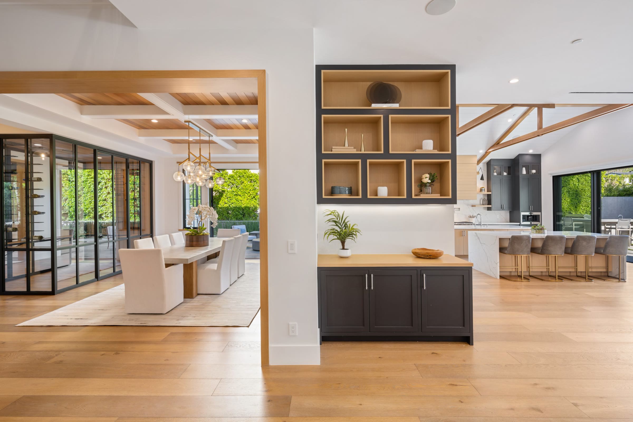 Open-plan living with oak floors, a dining room and an island kitchen